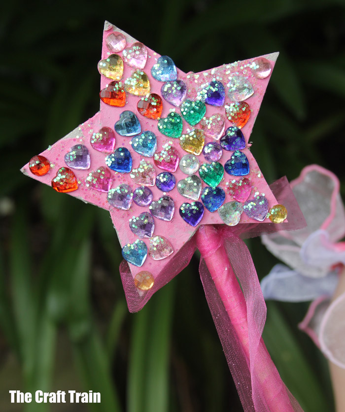 cute kid-made fairy wand covered in plastic gems. So magical!