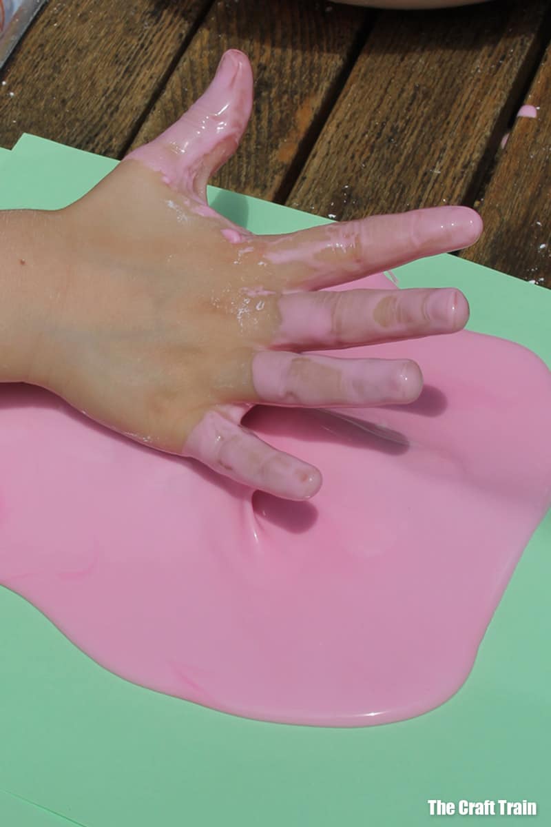 messy goo on coloured paper sensory play idea