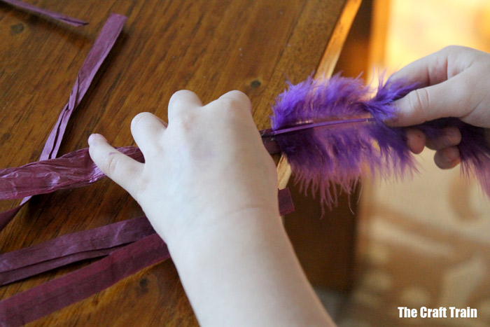 gluing on feathers