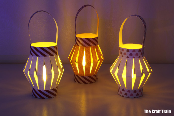 paper lanterns glowing with candles