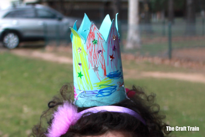 kid made party hat using our free printable template