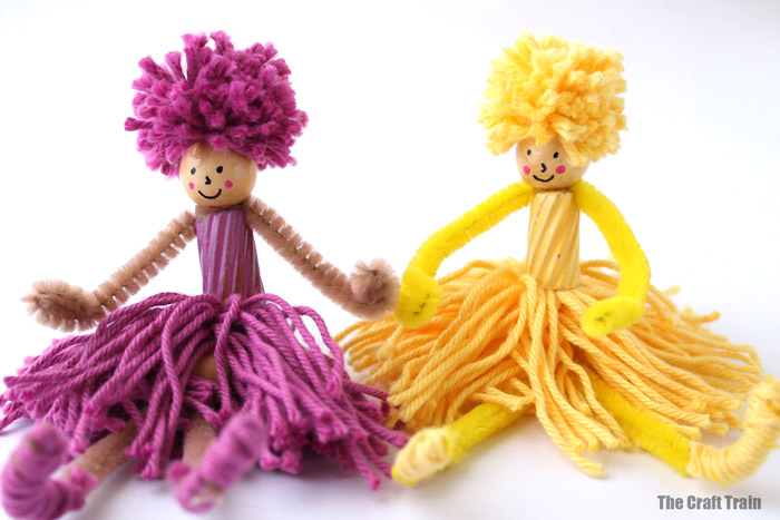 pom pom and pipe cleaner people sitting