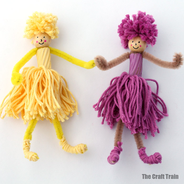 Pom pom and pipe cleaner dolls