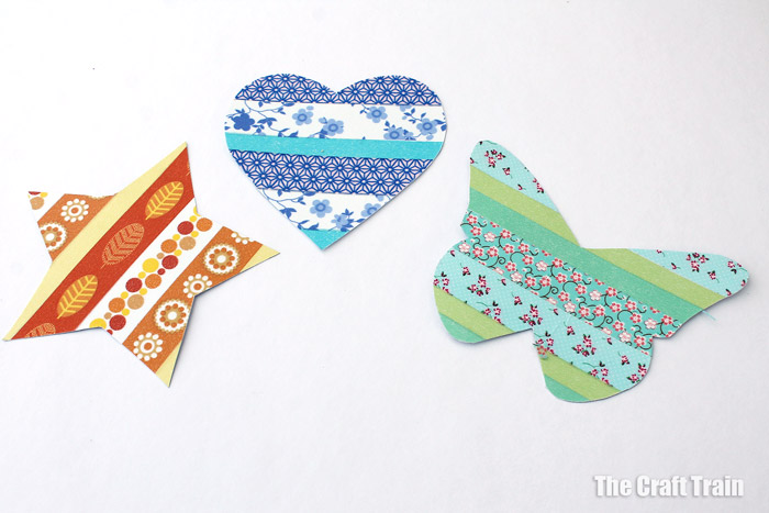 The finished paper shapes decorated with washi tape