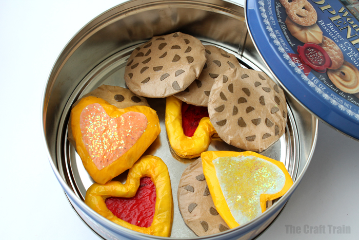 Paper biscuits ina a biscuit tin for pretend play