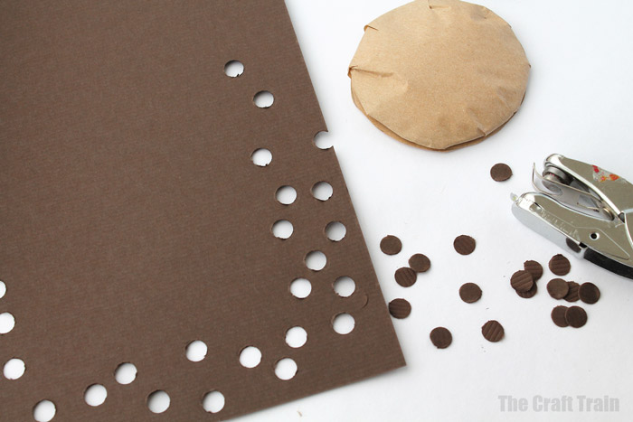 use a hole punch to make choc chips for your pretend cookies