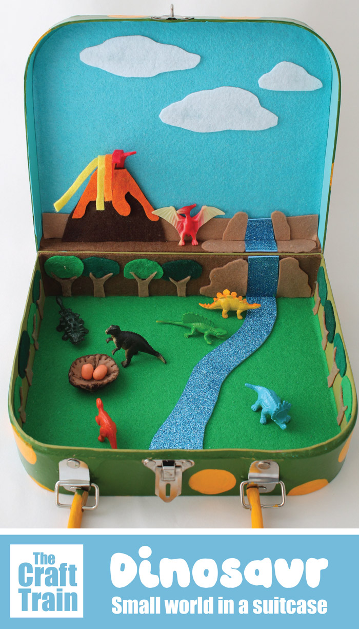Dinosaur small world in a suitcase. THis is an awesome DIY toy, perfect for travelling and playing on the go. It's a great way to encourage imaginary play and makes an awesome handmade gift #handmadegift #diytoy #dinosaurs #smallworld #suitcasecraft #kidsactivities #imaginaryplay #playmatters #thecrafttrain