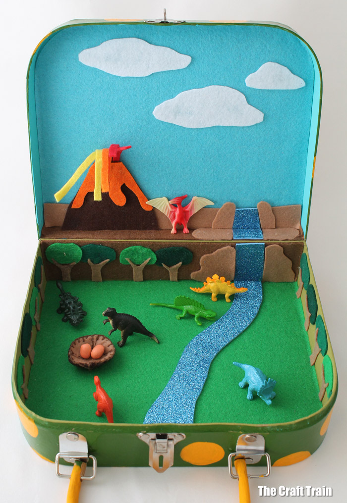 Dinosaur small world in a suitcase