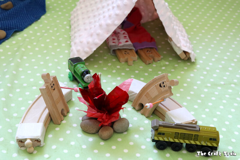 Create a camping small world for creative play. This idea is inspired by the book "Old Tracks New Tricks" by Jessica Peterson