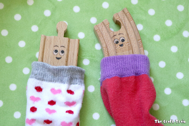 DIY sock sleeping bags for toys! Create a camping small world for creative play. This idea is inspired by the book "Old Tracks New Tricks" by Jessica Peterson