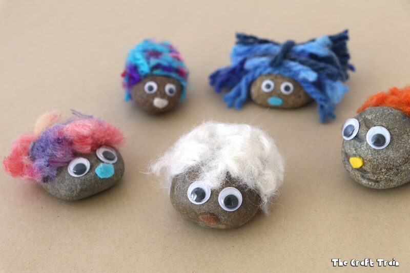 Create adorable fluffy pet rocks with pom pom trimmings. This is a simple rock craft idea for kids and makes a cute kid-made gift idea