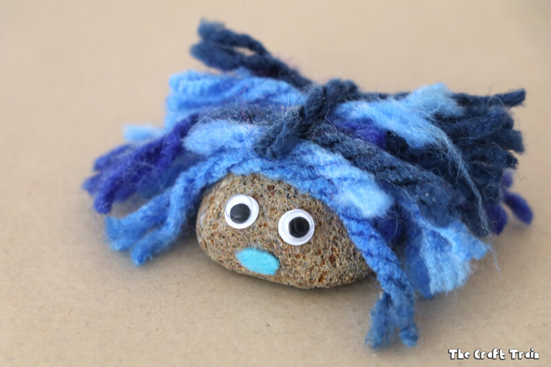 Create adorable fluffy pet rocks with pom pom trimmings. This is a simple rock craft idea for kids and makes a cute kid-made gift idea