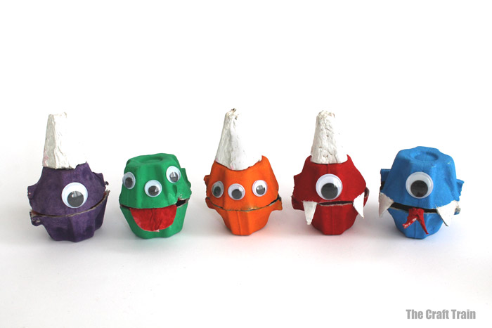 Finished monster treat holders made from egg carton in a line
