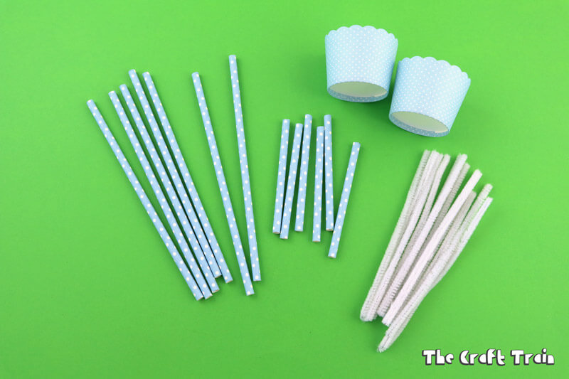 Swing set construction materials: paper straws, pipe cleaners and cupcake liners