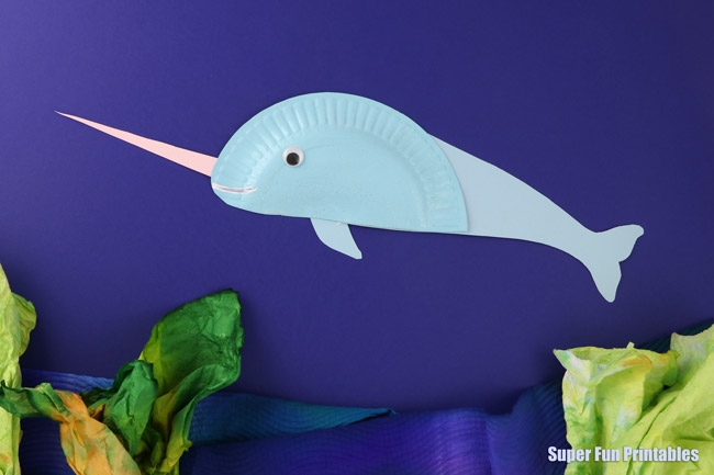 Adorable paper plate Narwhal craft, from the paper plate Ocean Animal ebook containing the templates for 14 amazing ocean animals along with facts and information kids will love to learn #oceananimals #crab #paperplate #kidscrafts