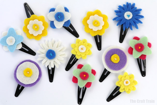 Easy DIY hair clips - make your own flower hair clips from felt using our printable pattern #diy #flowers #spring #hairaccessories #handmadegifts #giftideas #kidscrafts #kids #kidssewing