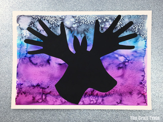 Christmas handprint art in peace dove, reindeer and angel designs. Create a process art background using liquid watercolour and salt, then use the printable template and handprint shapes to create the silhouette art #christmas #christmasart #handprint #handprintart #dove #peacedove #reindeer #angel