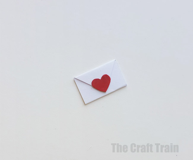 Step 2 - mini valentine matchbox craft for kids. Make the most adorable mini hand-sewn plushy heart delivered in a cute matchbox #valentine #valentinesday #matchboxcraft #kidssewing #felt #kidscraft
