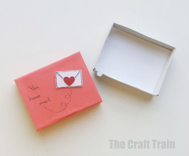 Step 4 - mini valentine matchbox craft for kids. Make the most adorable mini hand-sewn plushy heart delivered in a cute matchbox #valentine #valentinesday #matchboxcraft #kidssewing #felt #kidscraft