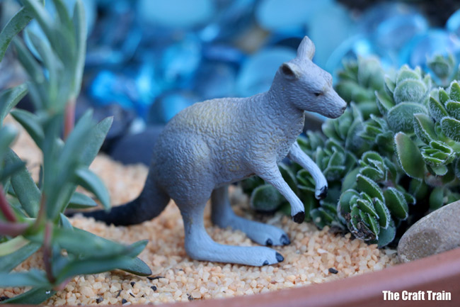 Kangaroo in our succulent garden with Australian animal theme. This is a fun gardening with kids project and makes a great small world for imaginary play or a handmade gift idea #succulents #succulentgarden #smallworld #gardeningwithkids #australiananimals #gardening #kidsactivities