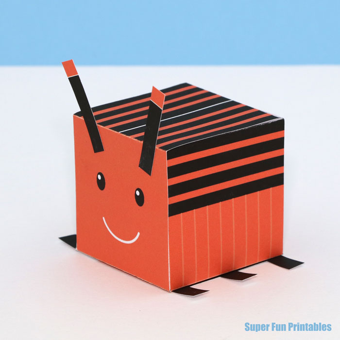 orange stripy bug craft for kids. Make an orange beetle from a 3D cube with this printable template