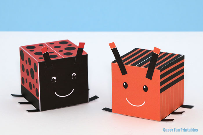 insect craft idea for kids. Make a ladybug and an orange stripy bug from 3D cubes with our printable template