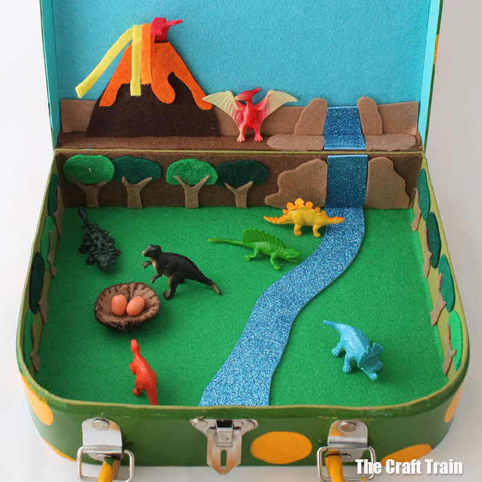 Dinosaur small world in a suitcase