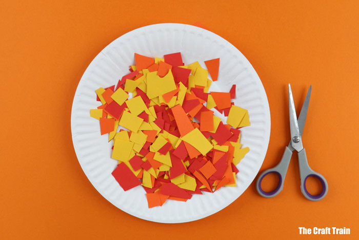Snip the paper scraps up to create mosaic pieces