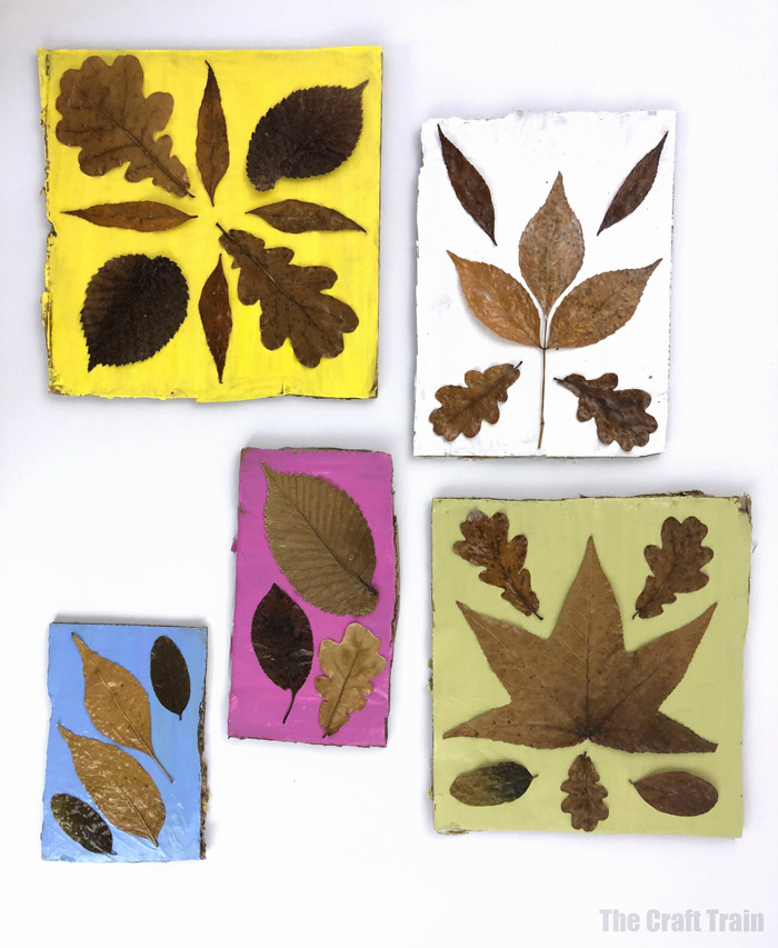 Easy nature craft idea for kids - pressed leaves on scrap cardboard which has been painted in bright colours