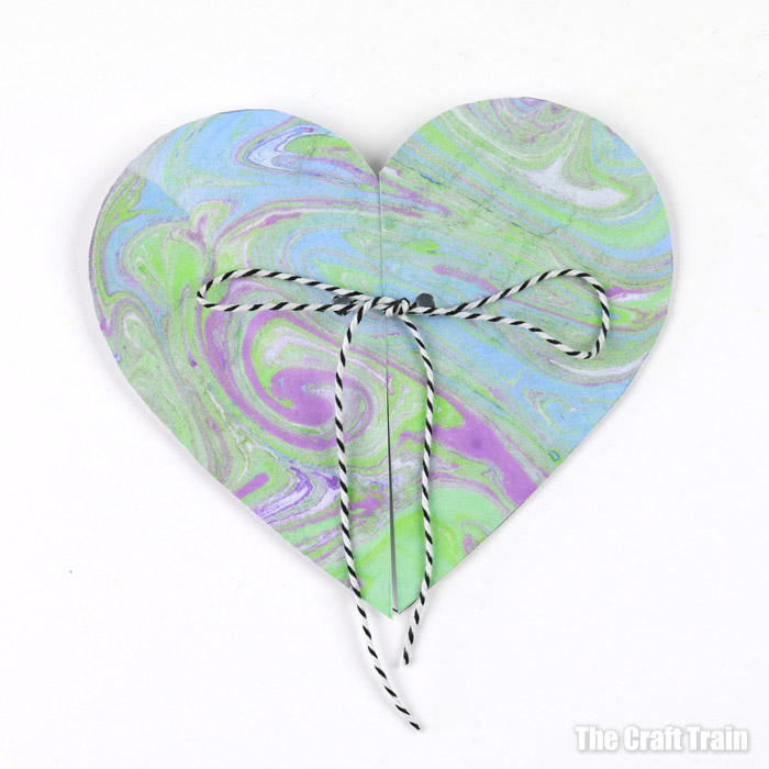 finished marbled heart Valentines Day card tied with bakers twine