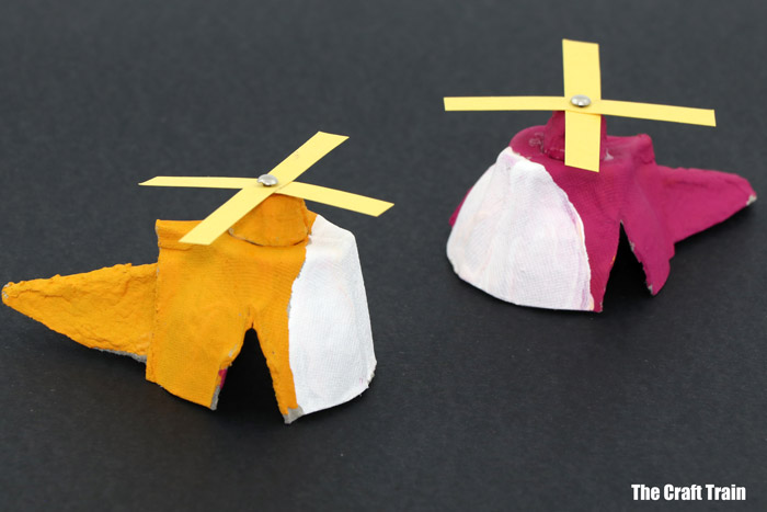 a yellow andpink egg carton helicopter with a paper propellor – so fun