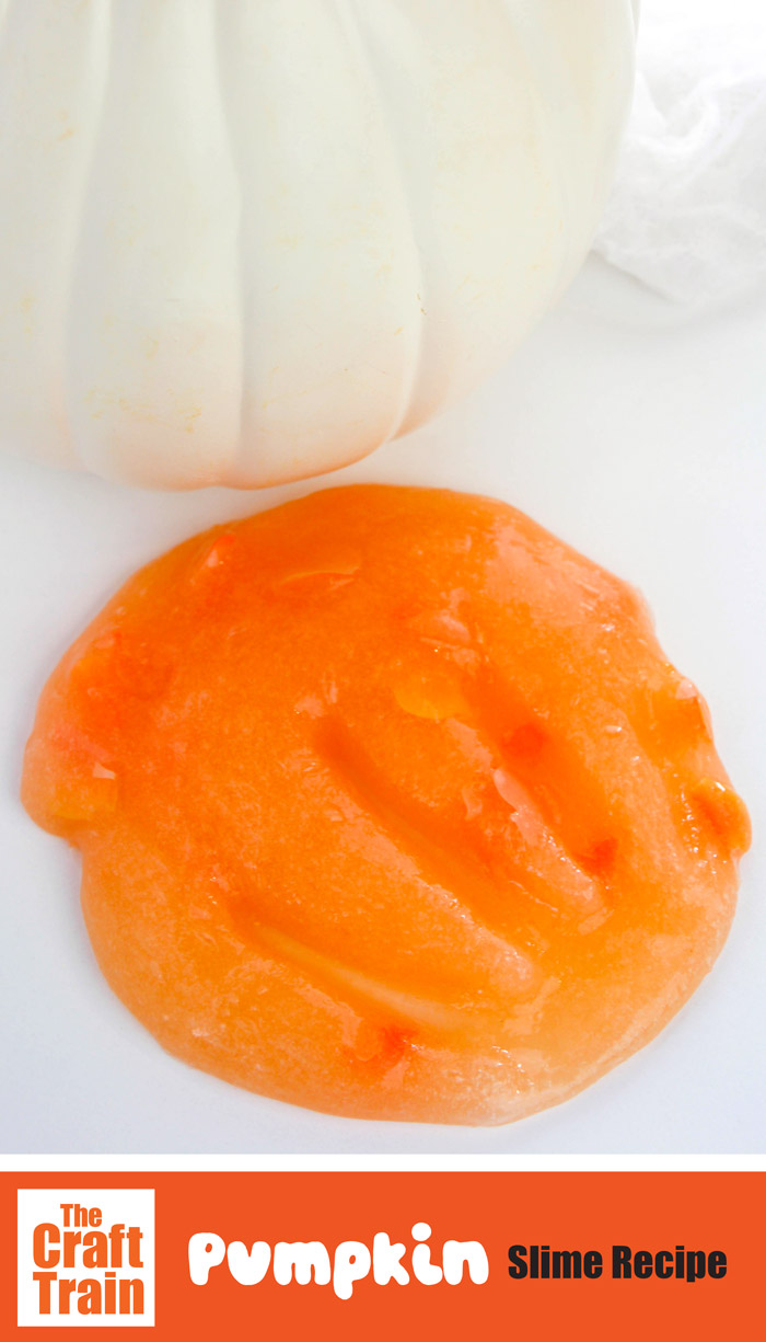 pumpkin slime recipe with handprint in the slime and white pumpkin in the background