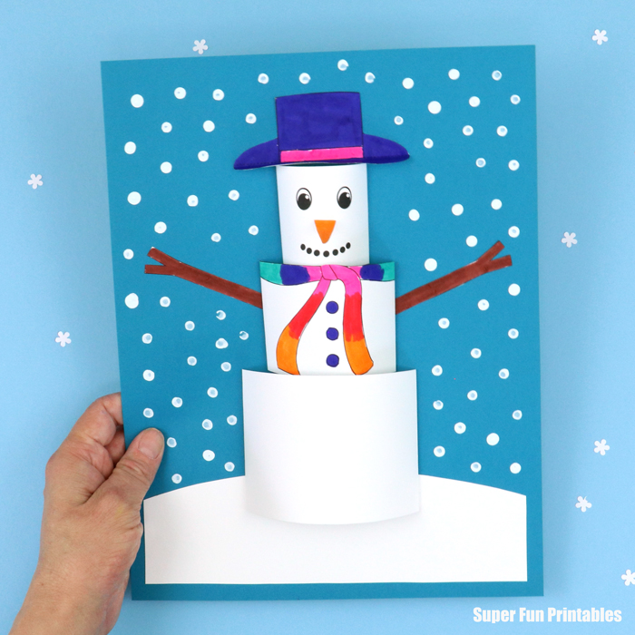 3D paper snowman craft surrounded by falling snow