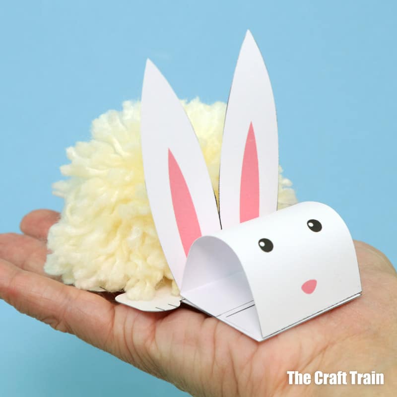 Adorable white and fluffy pom pom bunny craft with printable template