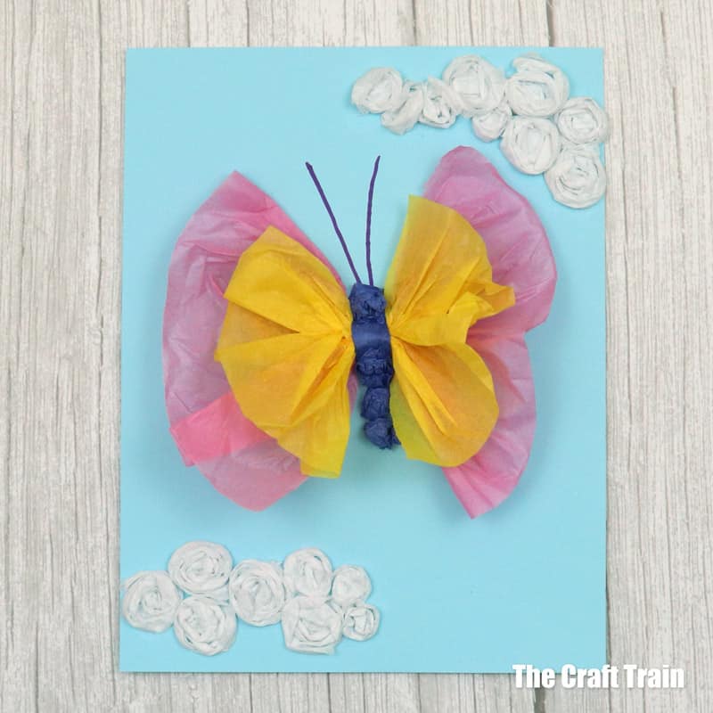 Tissue butterfly art idea for kids made from scrunched tissue paper glued to coloured card stock
