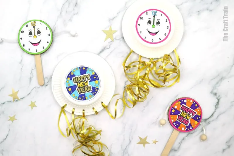 Noise maker craft for kids to celebrate New Year. Make a cardboard spin drum or a paper plate shaker filled with recycled beer bottle caps