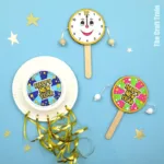 New year noise maker craft with printable template. Make a spin drum or a paper plate shaker