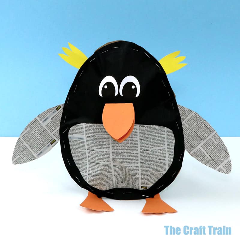 Stuffed paper penguin craft for kids made from recycled paper