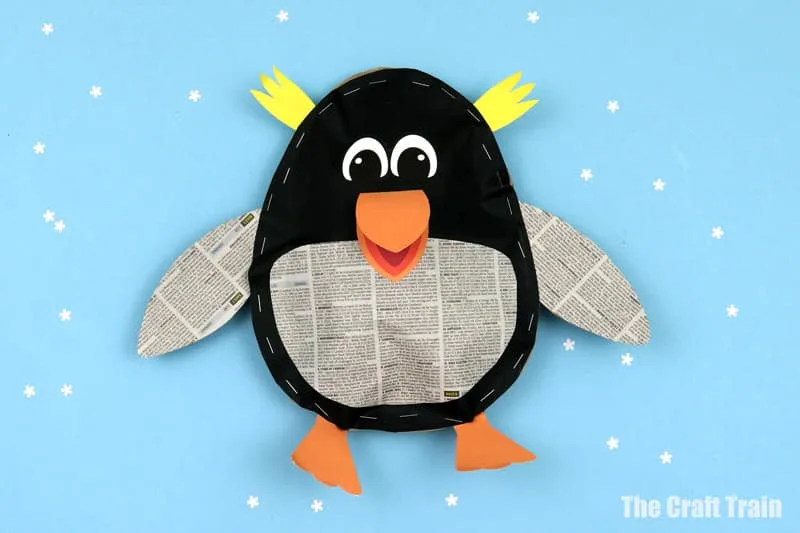 Finished stuffed paper penguin craft made from recycled paper