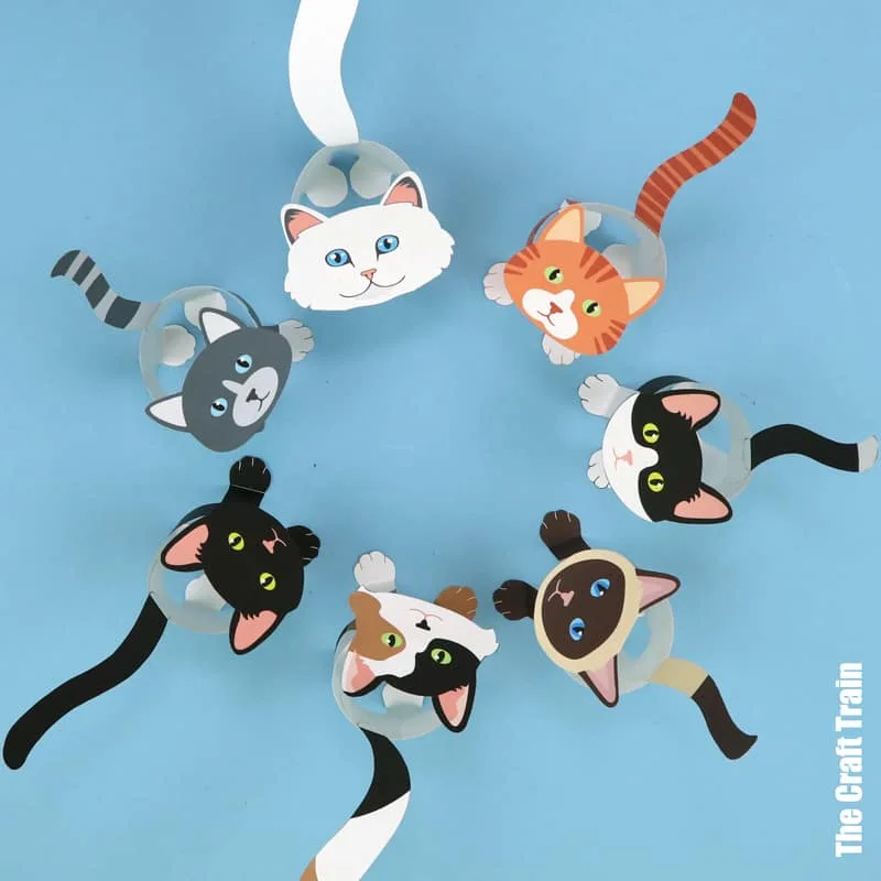 Paper cats in a circle looking up