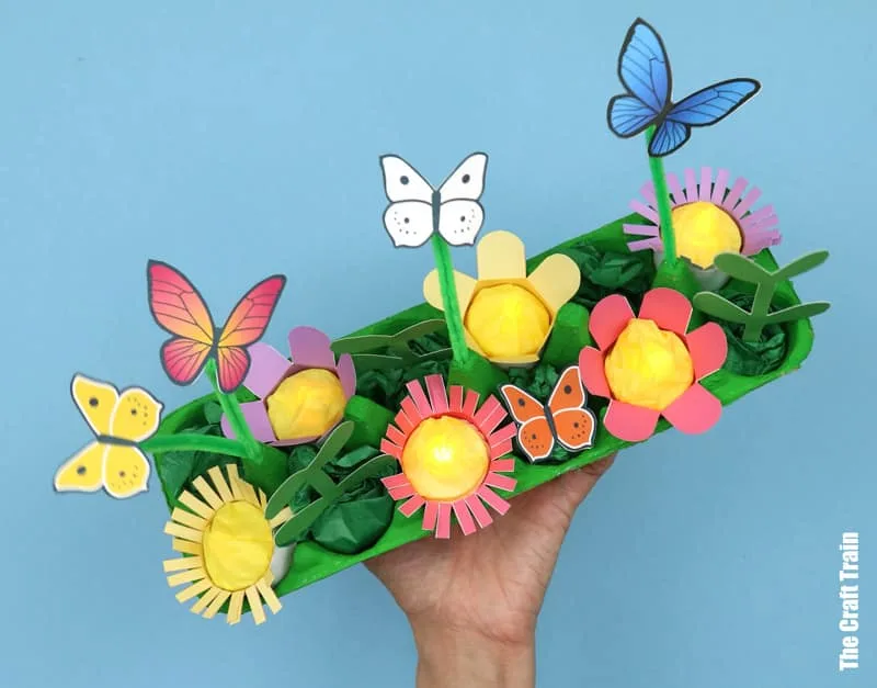 Top view of egg carton butterfly garden printable craft